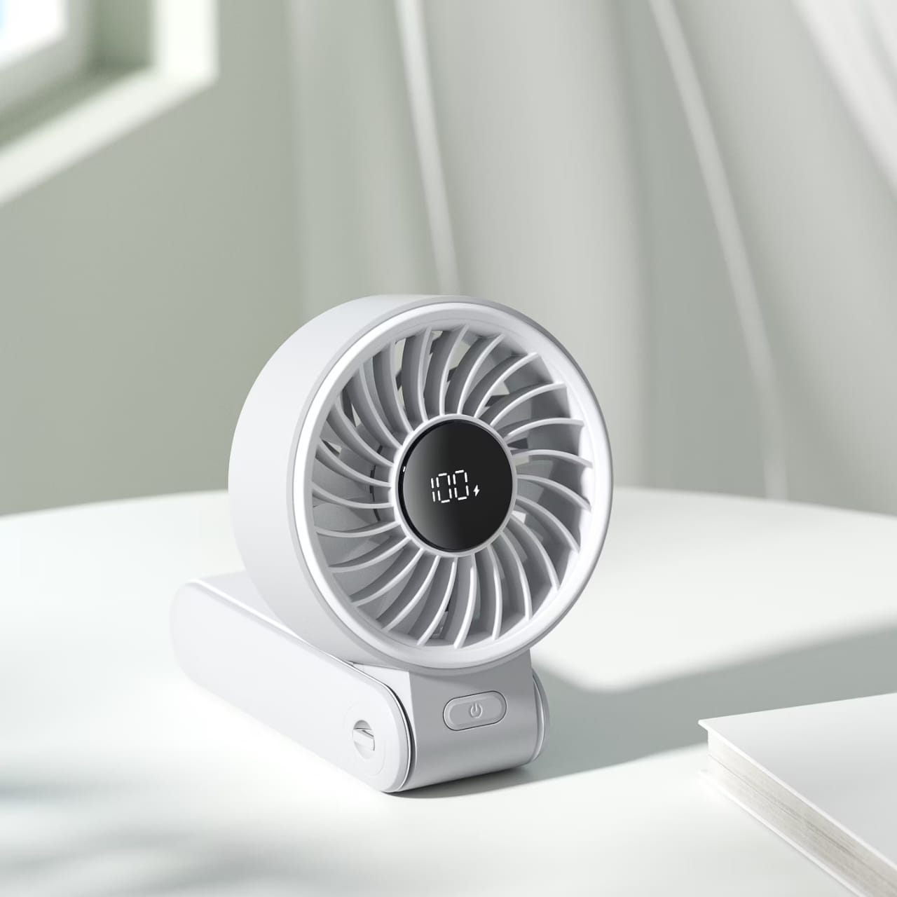 Jisulife Handheld Portable Fan Life 7 placed in a tale