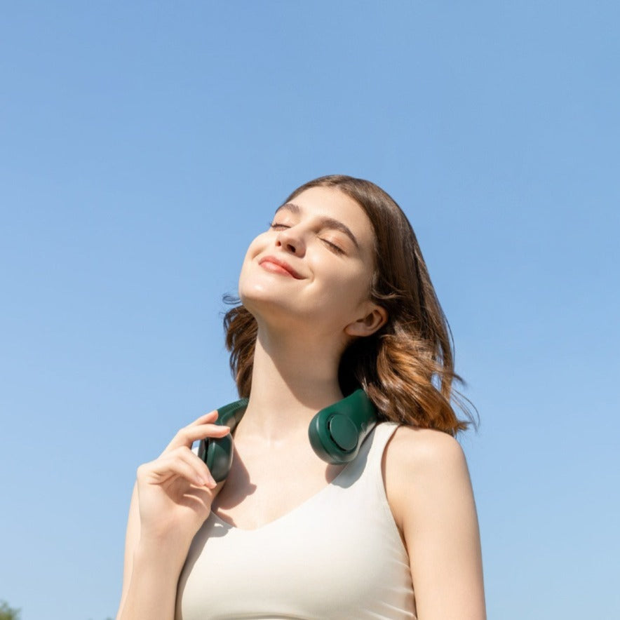 A Woman is Wearing Jisulife Neck Fan Life 3.