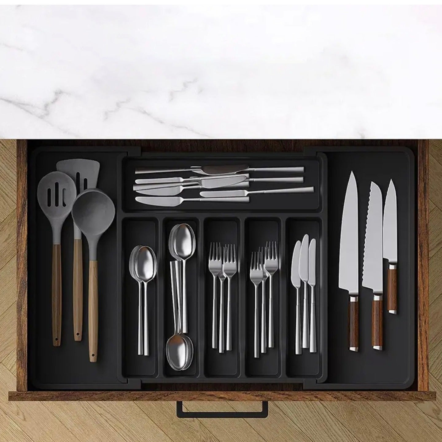 Kitchen Tableware Storage Box inside a drawer showing neatly organized knives, spoons, forks, and cooking utensils in multiple compartments.