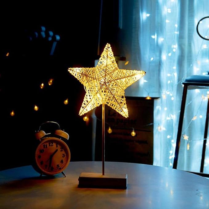 LED Star Table Lamp Decorative Night Light is Placed on a Table.