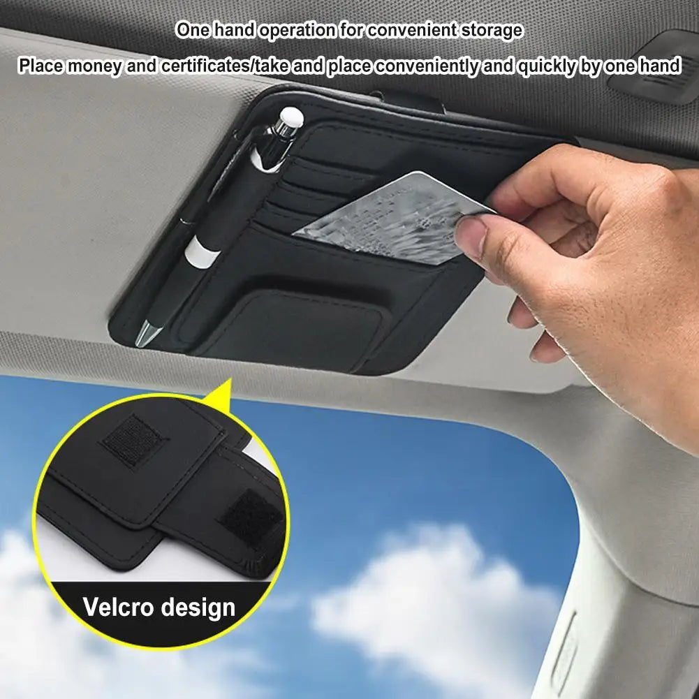 some one taking something form the Leather Car Sun Visor Organizer
