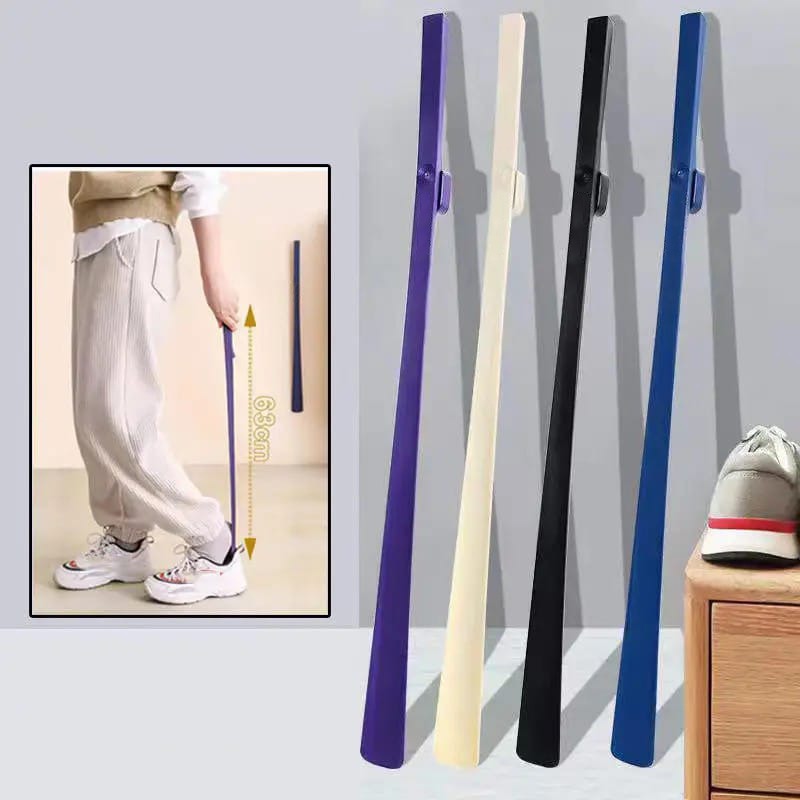 A Person is Wearing Shoe Using Long Handle Shoe Horn.