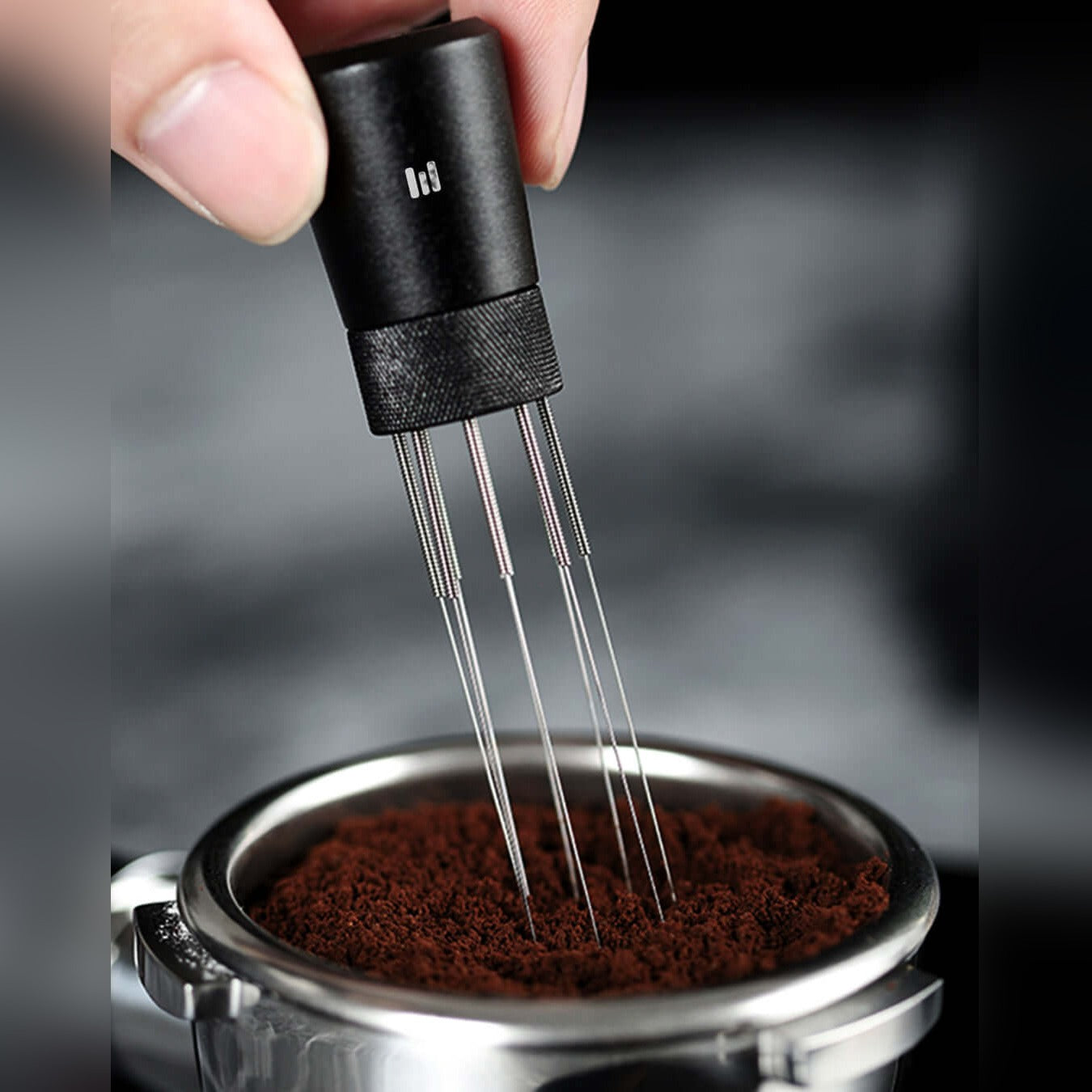 A Person is Stirring Coffee Powder With Macnoa MacStir - Eight Needles Magnetic WDT Tool.
