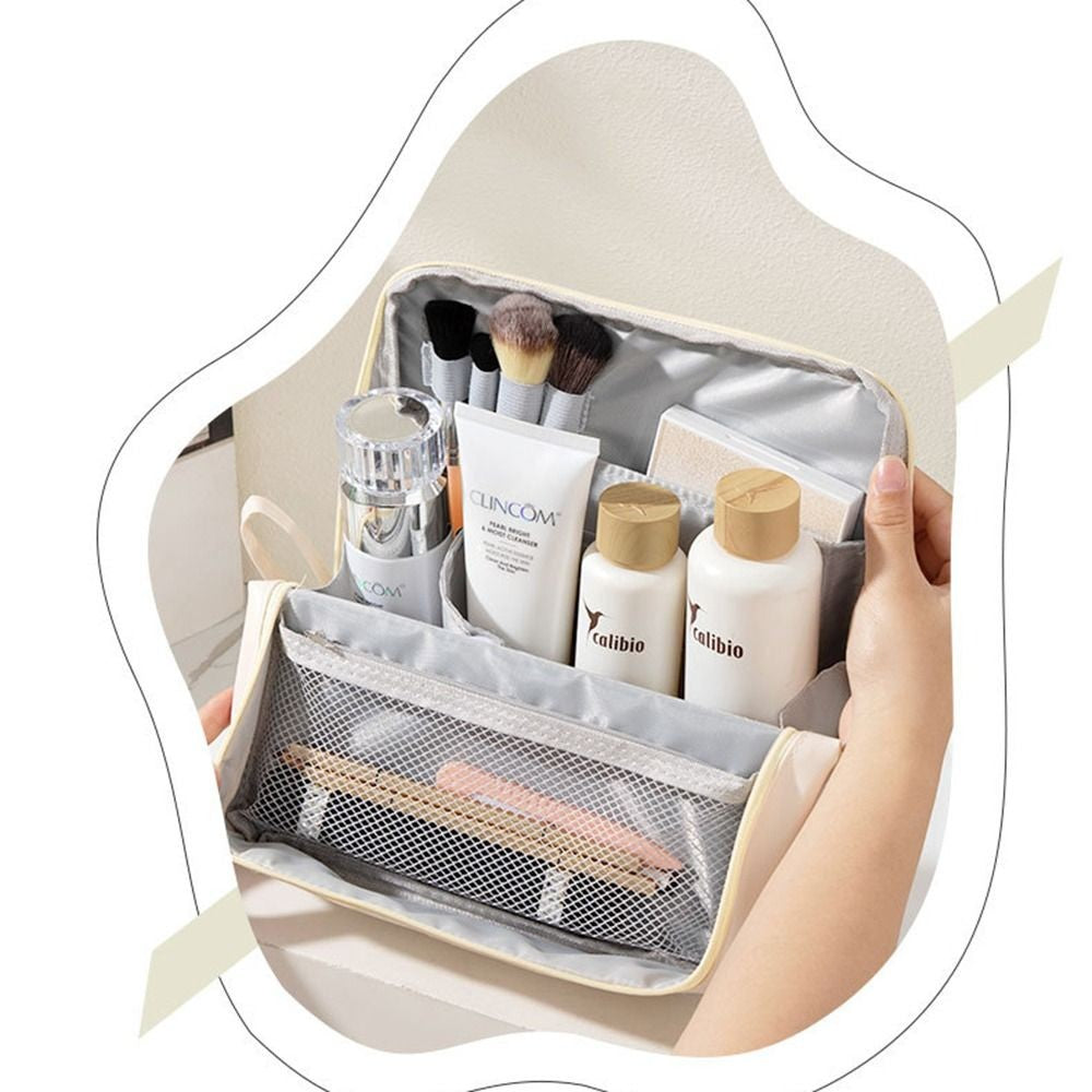 A Person is Holding Makeup Bag Cosmetic Storage Organizer Organized with Makeup Essentials.