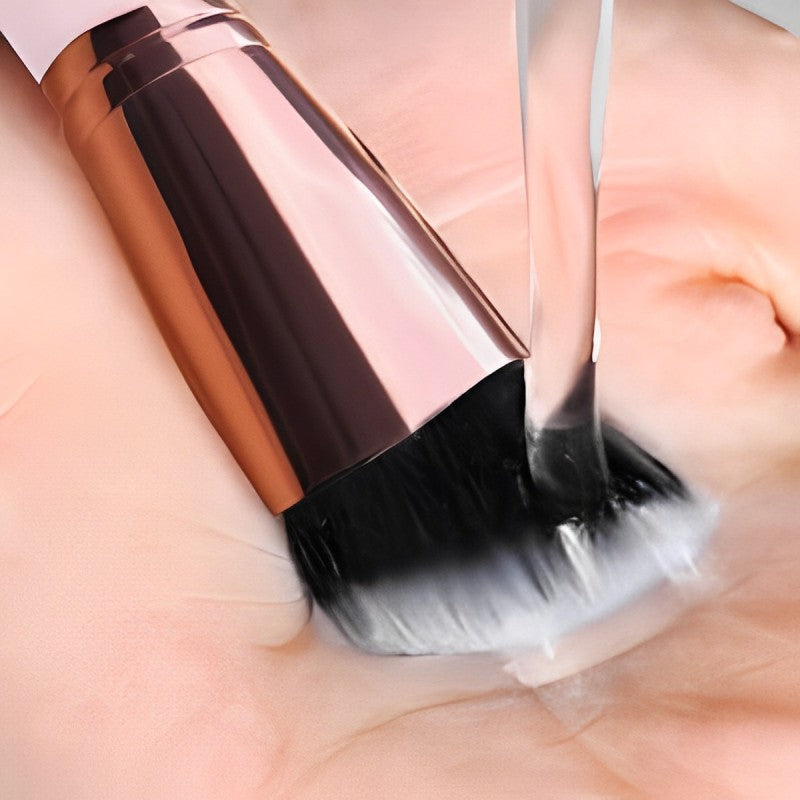 Someone is using the 16-Piece Makeup Brushes Set Kit with Premium Synthetic Bristles and an Eyebrow Razor