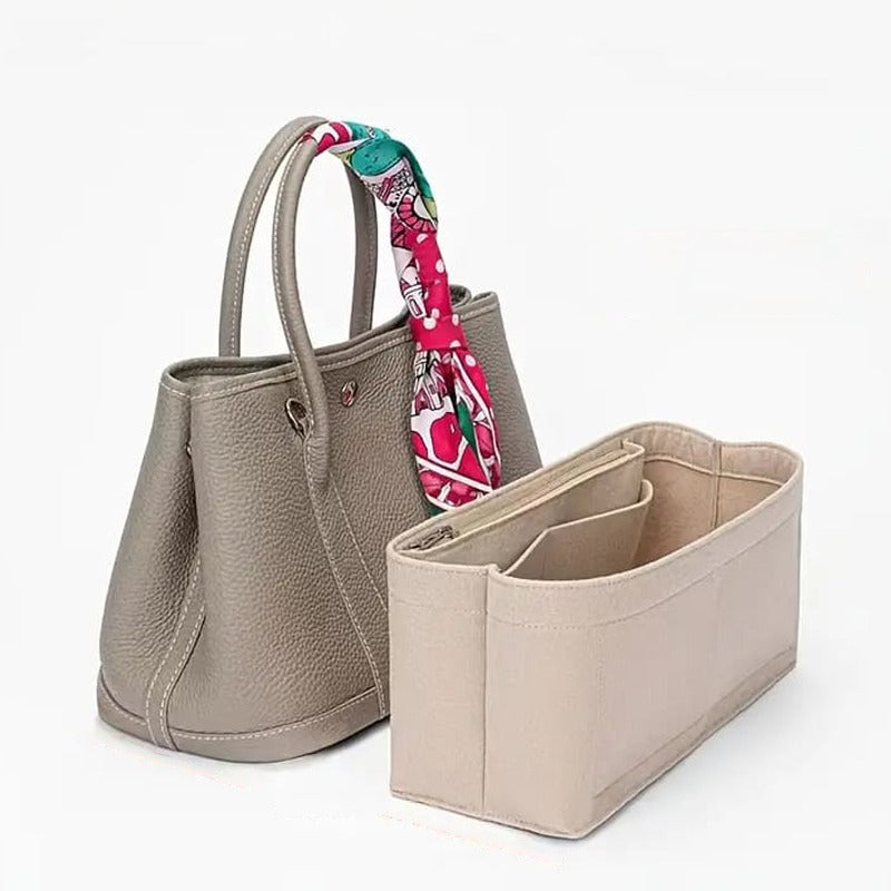 Makeup Cosmetic Storage Organizer Bag Placed Near a Handbag.