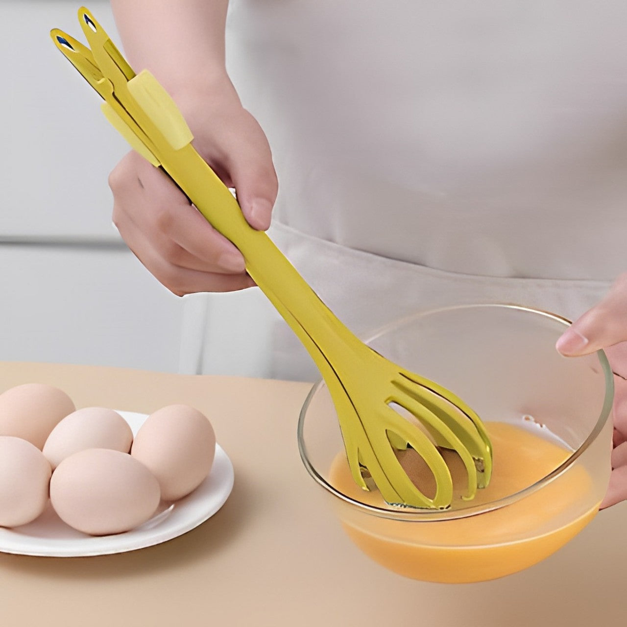 A Person Beats Egg Using Multi-purpose Manual Kitchen Whisk.