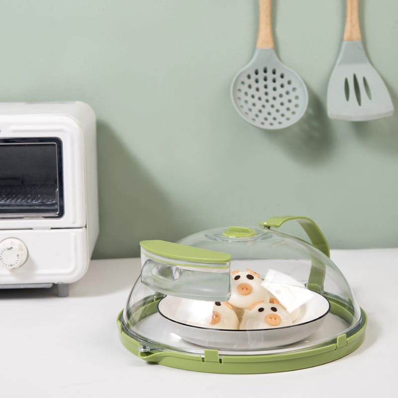 Microwave Oven Splatter Cover With Handle is Placed Near Oven..