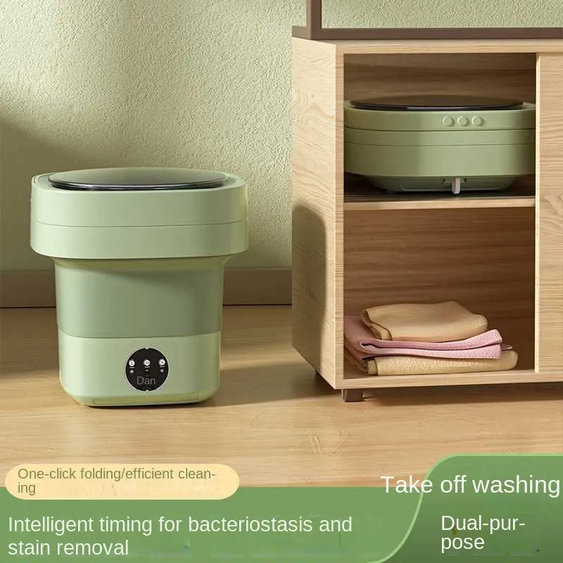 A mini foldable washing machine next to a wood shelf