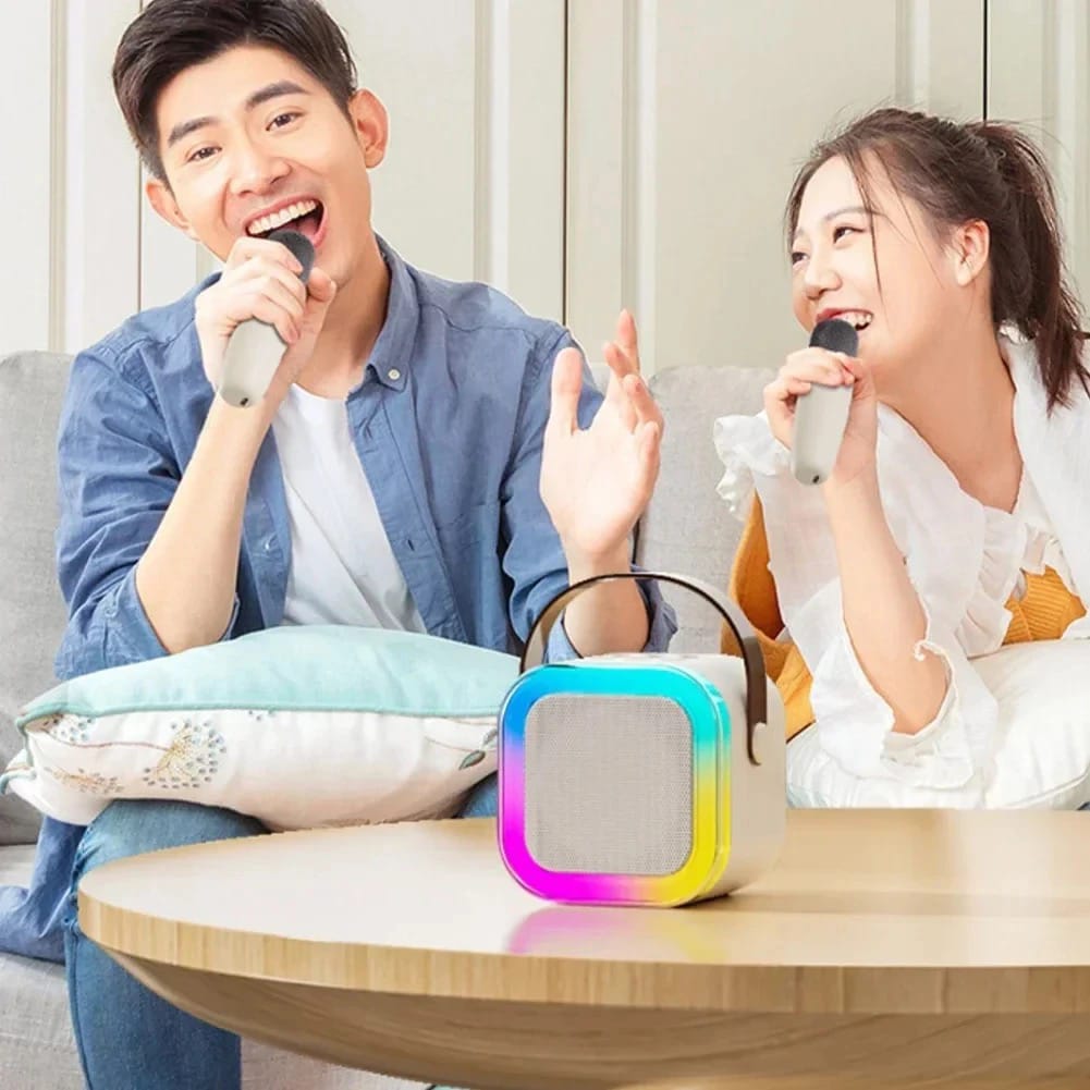 A Couple is Singing Song Using Mini Bluetooth Speaker With Wireless Karaoke Microphone.