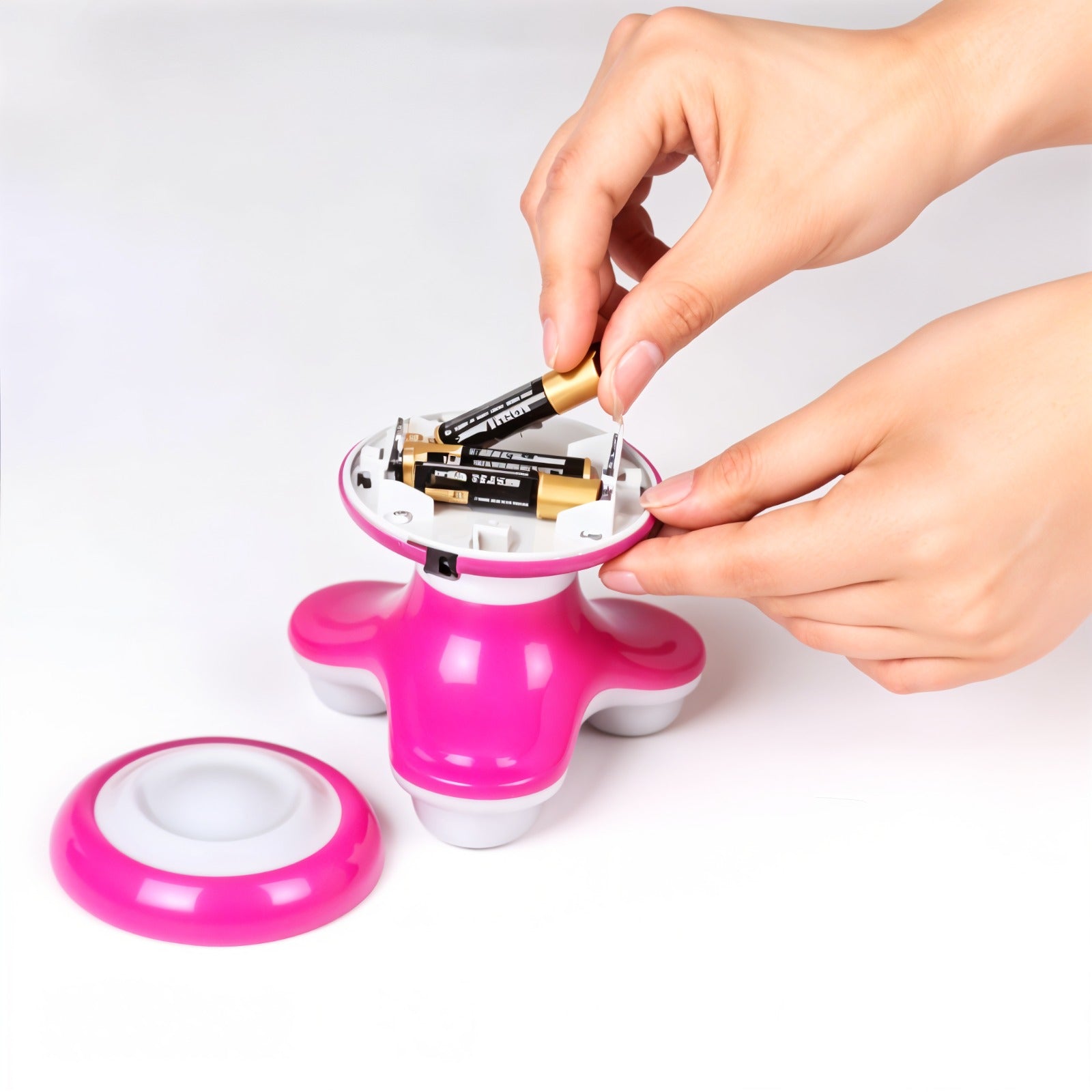 A Person is Installing Battery on to Mini Electric Massager.