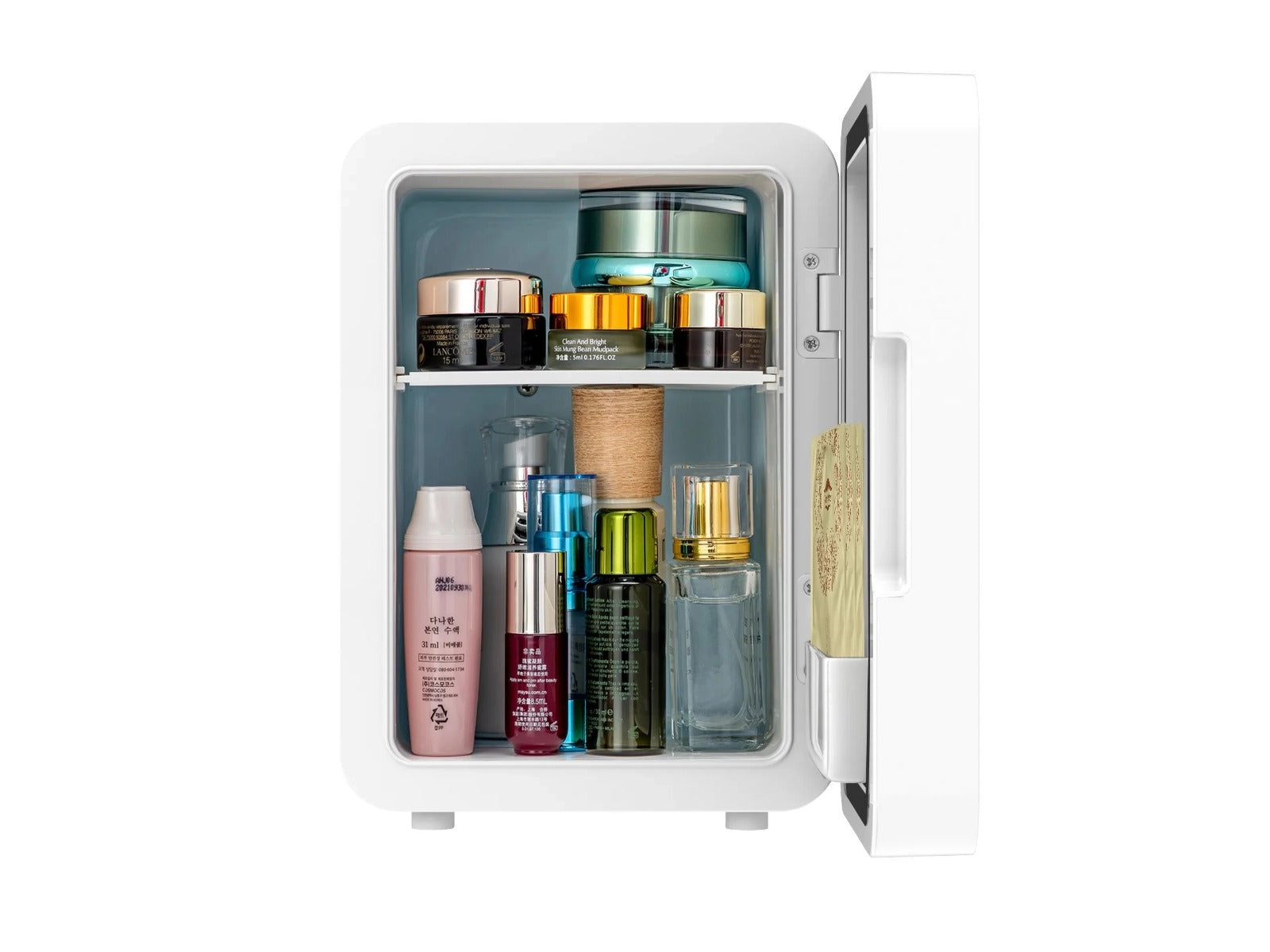 Makeup Items and Cosmetics Are Arranged On the Mini Multifunction Cosmetic Refrigerator With Mirror.