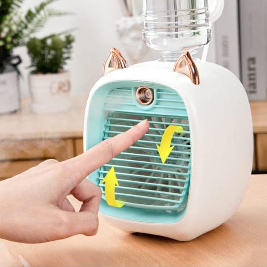 Mini Spray Cooling Fan In Green Color.