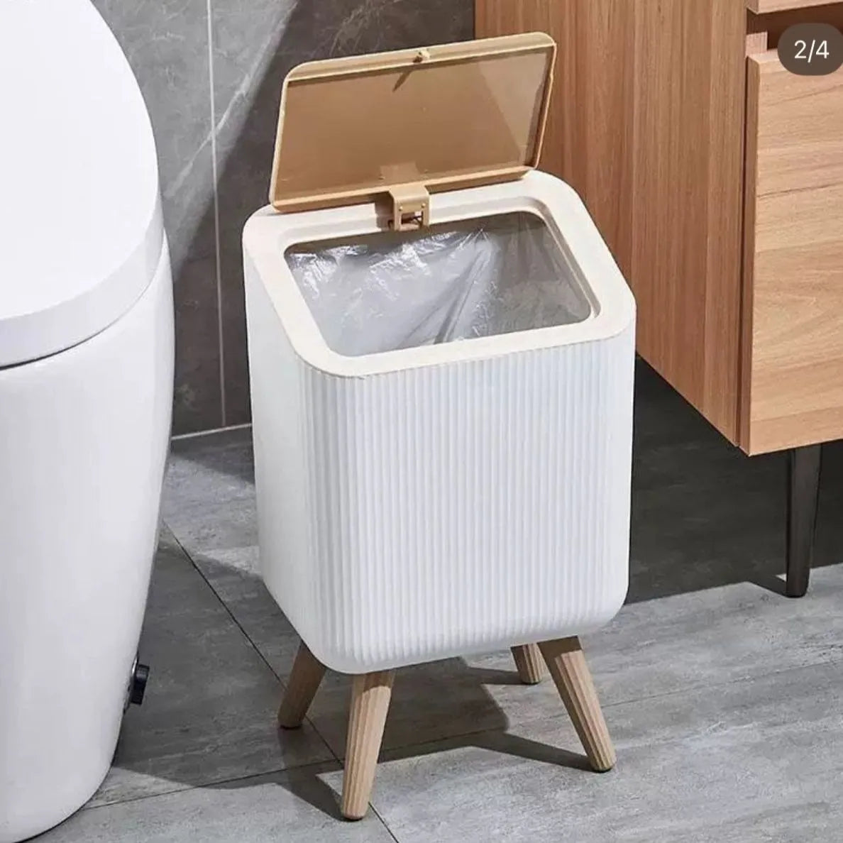 Modern Push Top Trash Can with Lid Placed at Bathroom Area.