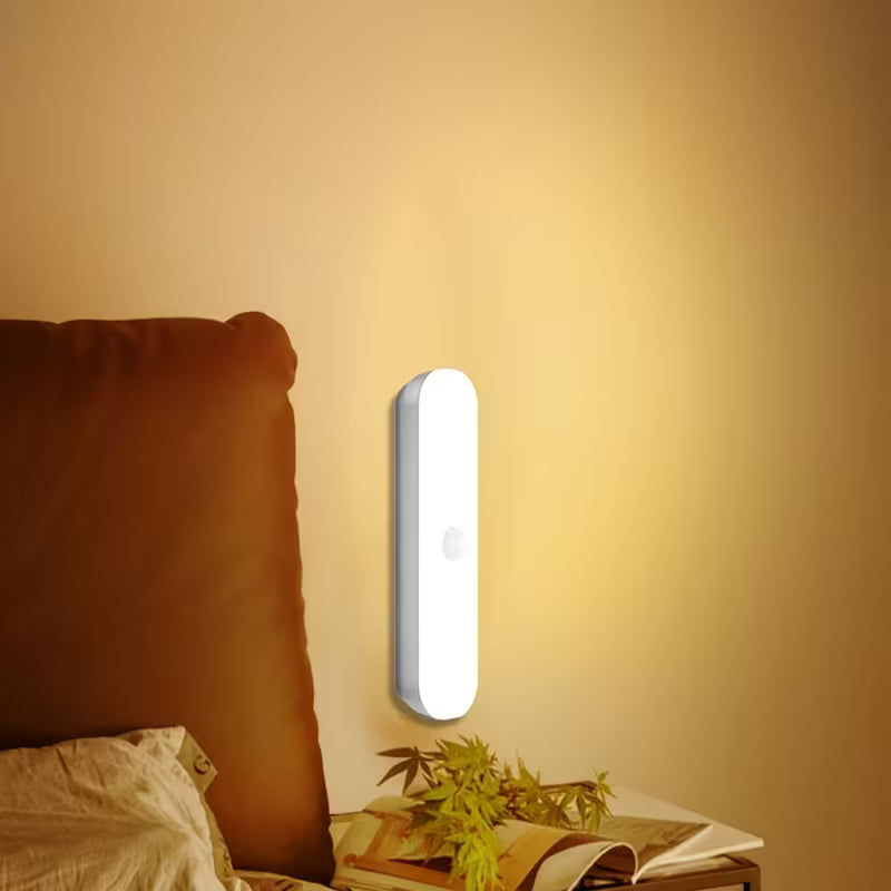 Motion Sensor Night Light is Attached on the Side of Bed.