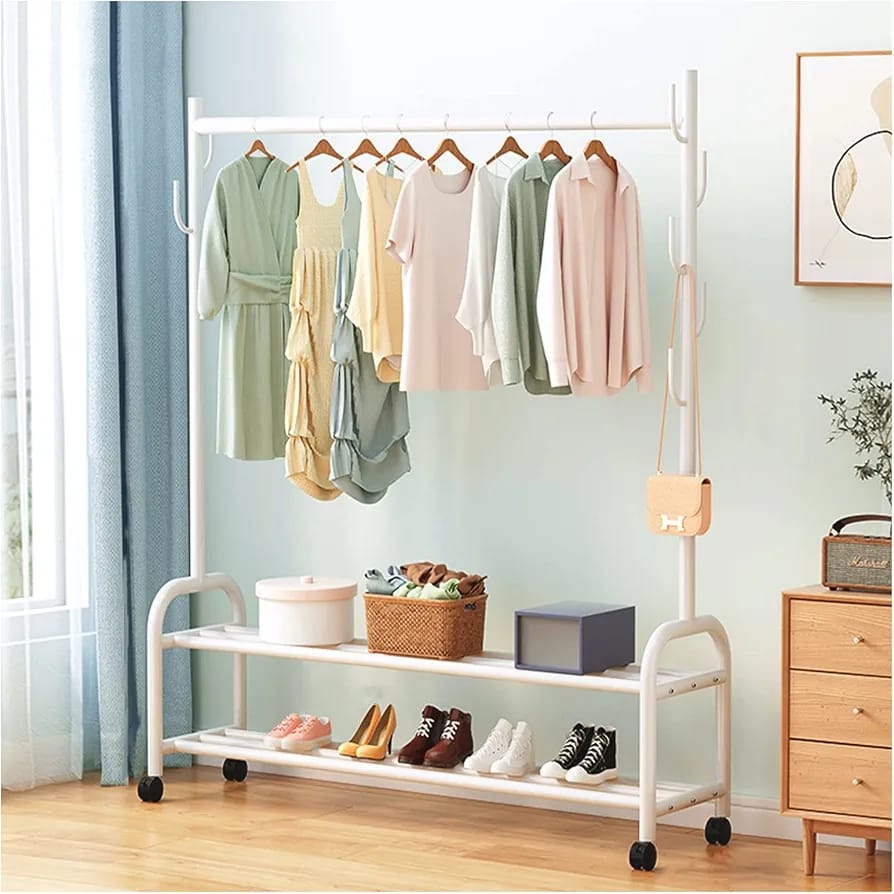 Movable Cloth Display Stand With Clothes and Shoes Are Arranged On it.