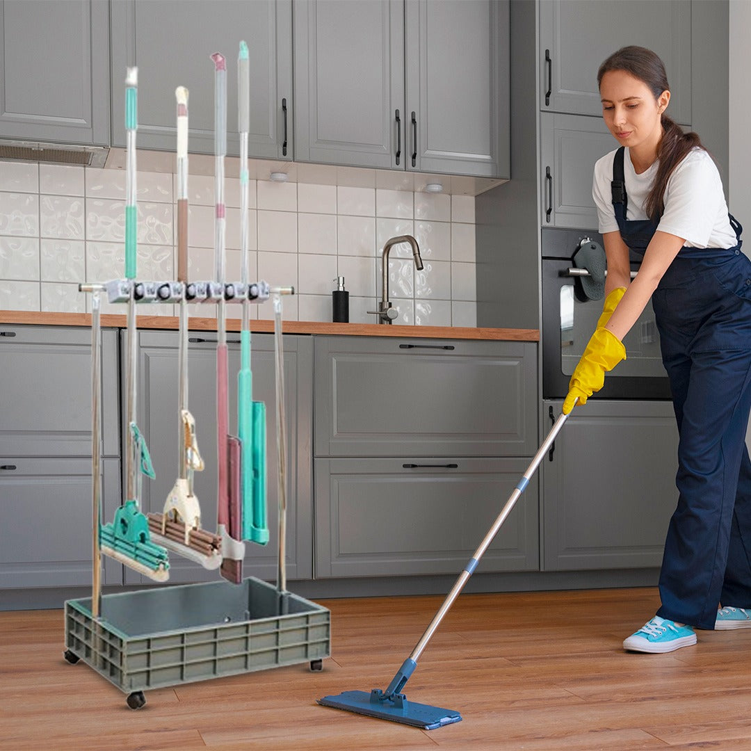 A Women is Using Movable Mop Broom Holder.