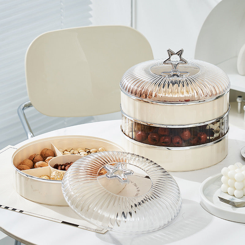 Multi-Layer Snack Storage Container With Lid Having Dried Fruits.