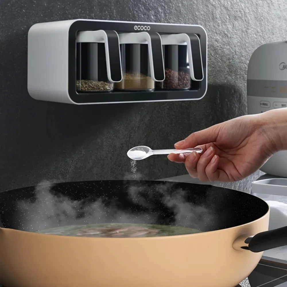 ECOCO 3 Cups Wall Mount Spice Rack Organizer placed on the wall