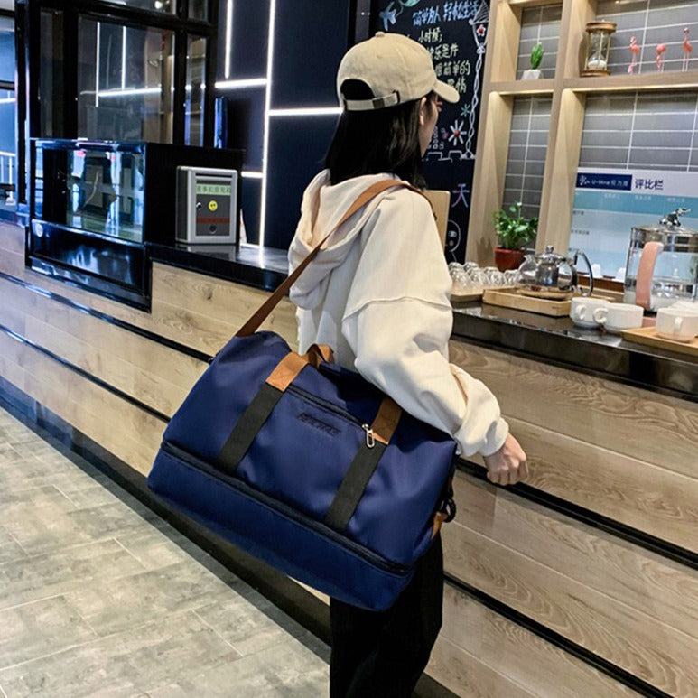 A Girl is Carrying Multi-functional Fashion Fitness Travel Duffle Bag.