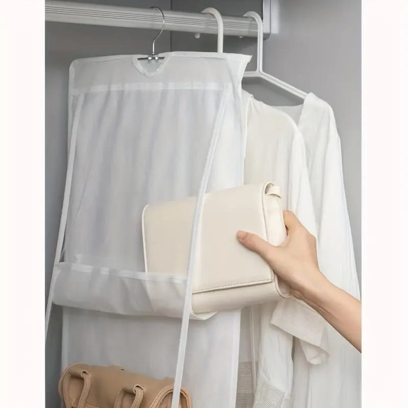 Someone taking a bag from the Multi-layer Handbag Hanging Organizer