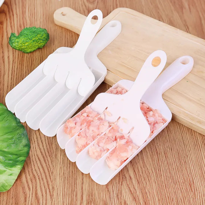 he 4-in-1 Kitchen Meatball Maker Tool is placed on the table with raw meats