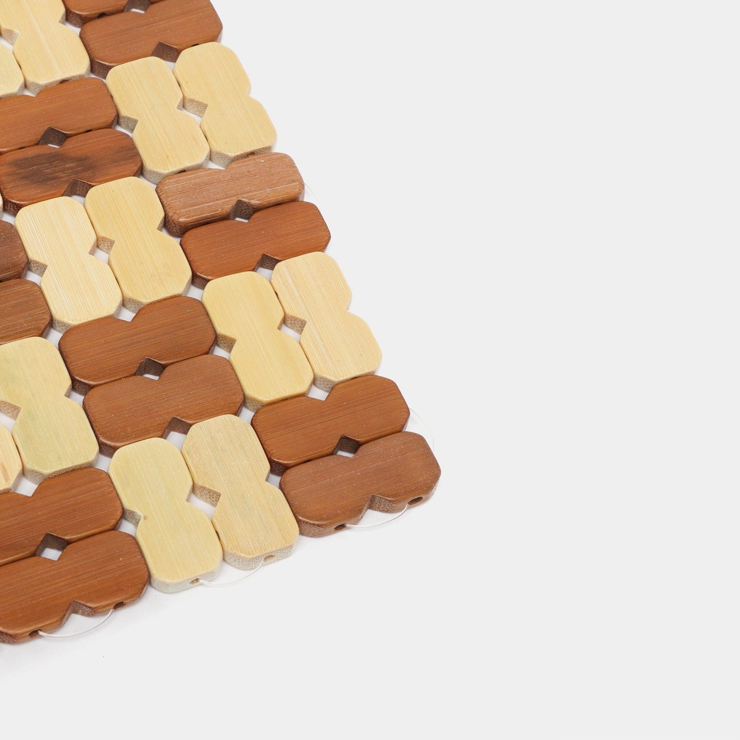 Natural Bamboo Heat Insulation Pad with interlocking pieces on a white background
