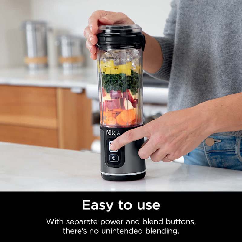 A Person is Operating Ninja Blast Portable Blender.