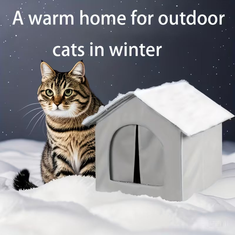 Cat peeking out from a snow-covered cat house with text 'A warm home for outdoor cats in winter'.