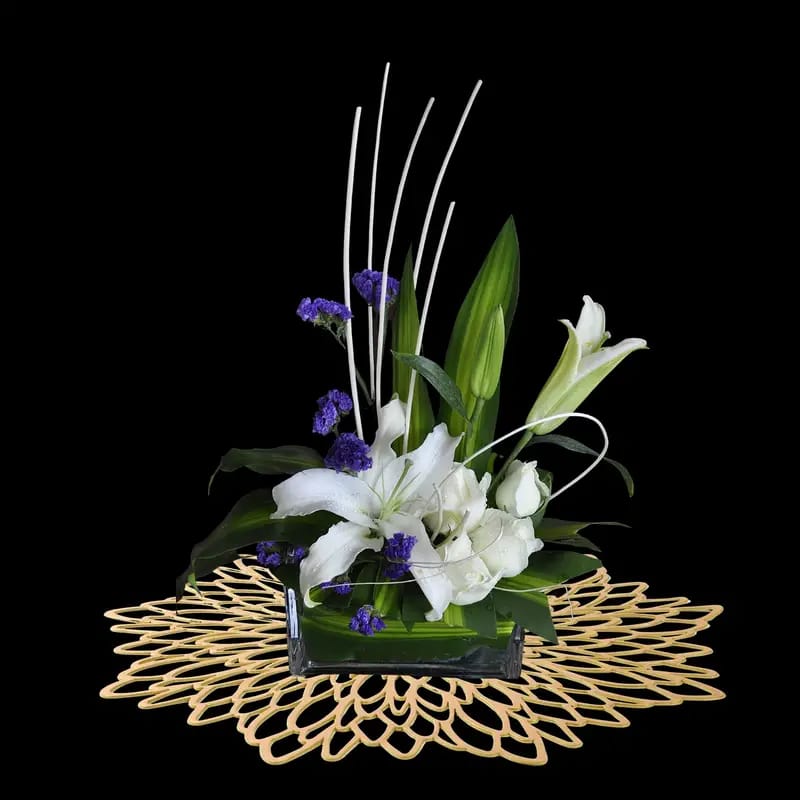 A Flower Vase is Placed On Party Dining Table Mat.