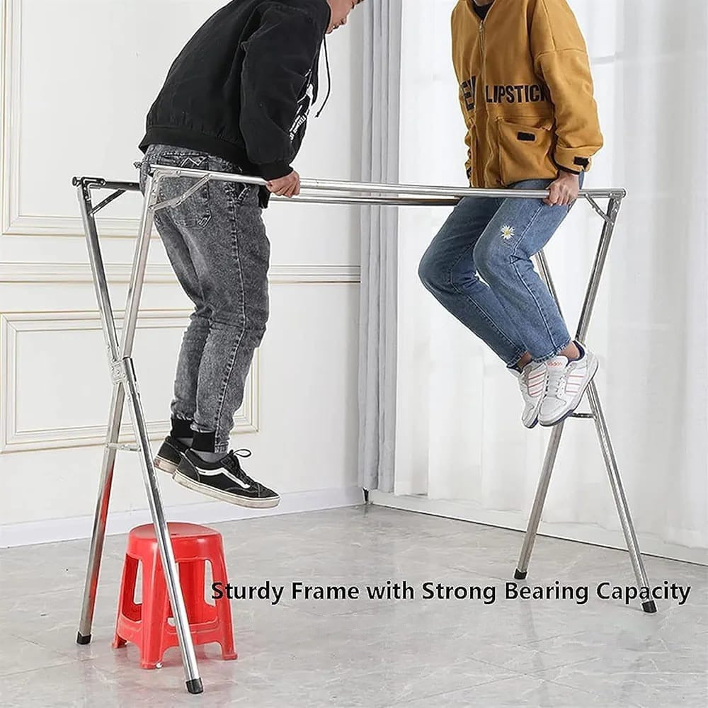 Two People are Testing the Capacity Of Foldable Cloth Drying Rack.