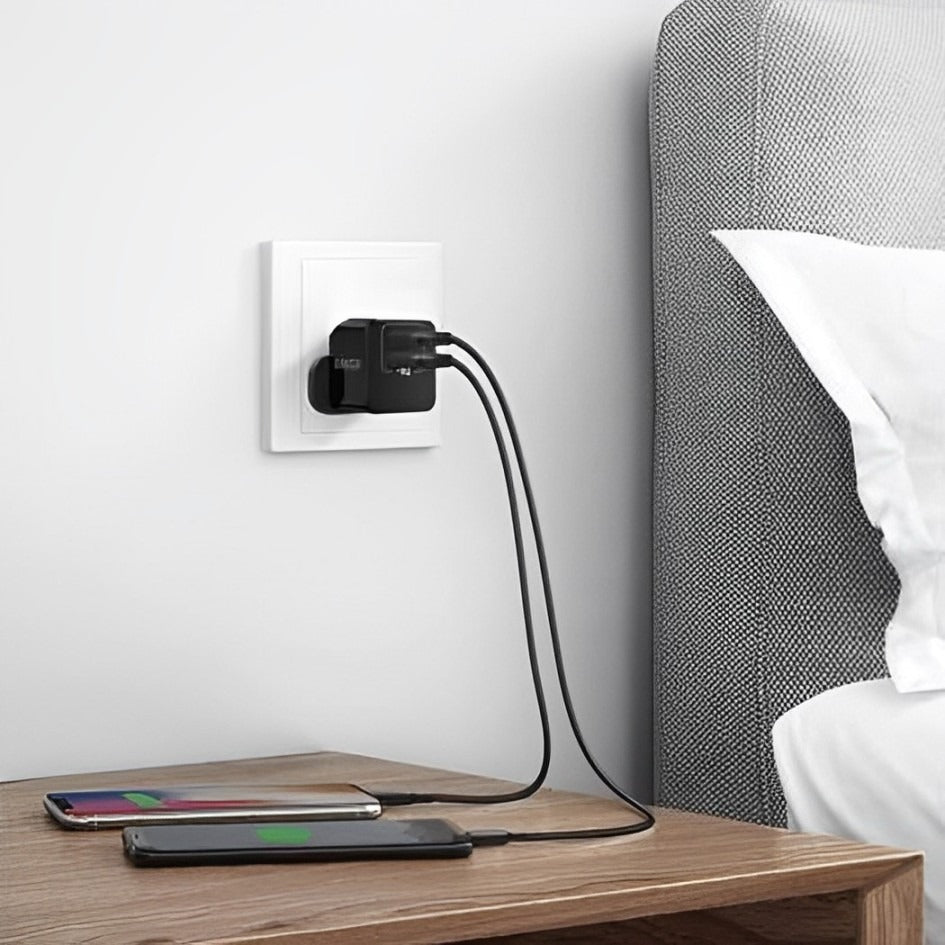 Two Mobile Phones are Connected to Anker PowerPort mini, 12W Dual-Port USB-A Wall Charger - A2620K12.