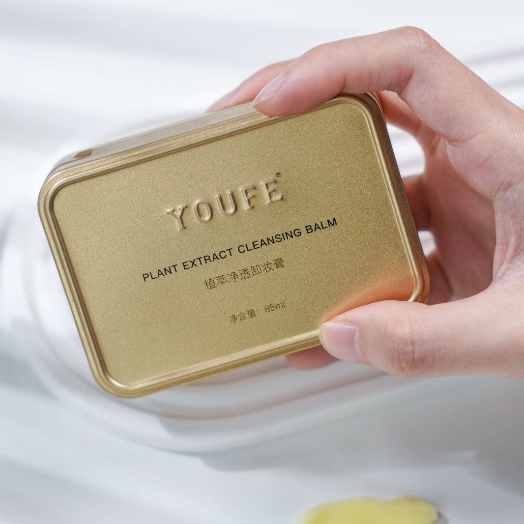 Someone is Holding Plant Extract Cleansing Balm.