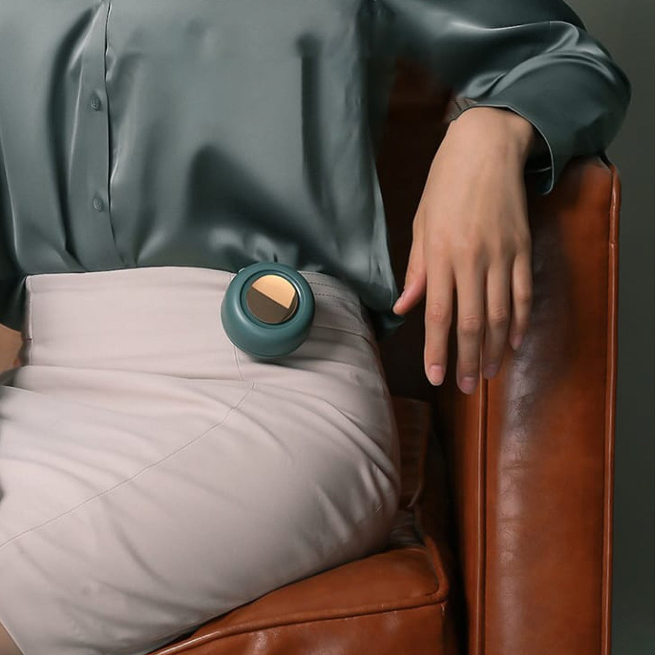 A Woman is Attached Pocket Clip Fan on her Waist Area.