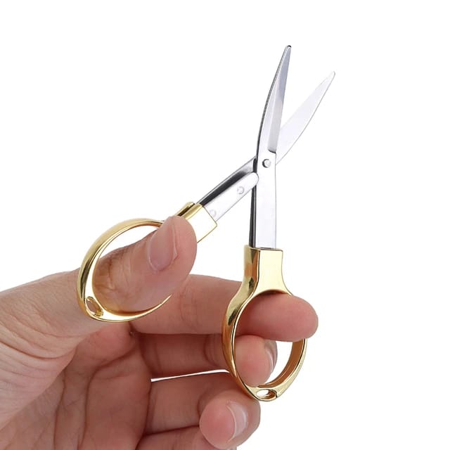 Travel Portable Folding Pocket Scissors holded in hands.