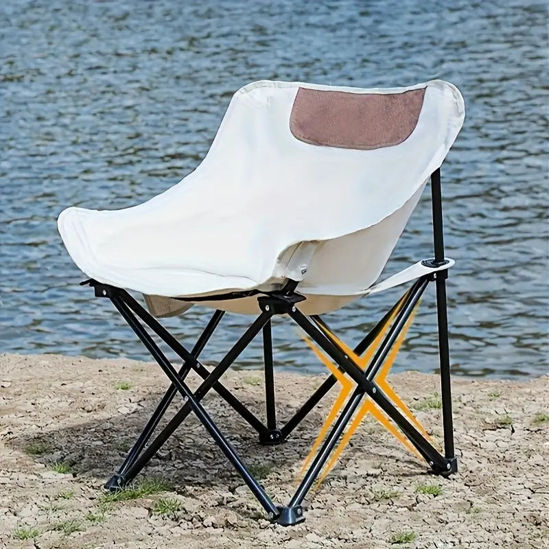 Portable Folding Camping Chair is Arranged near Camping Area.