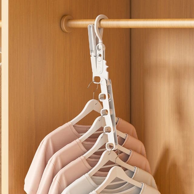 Portable Foldable Clothes Hanger hanging on a rack