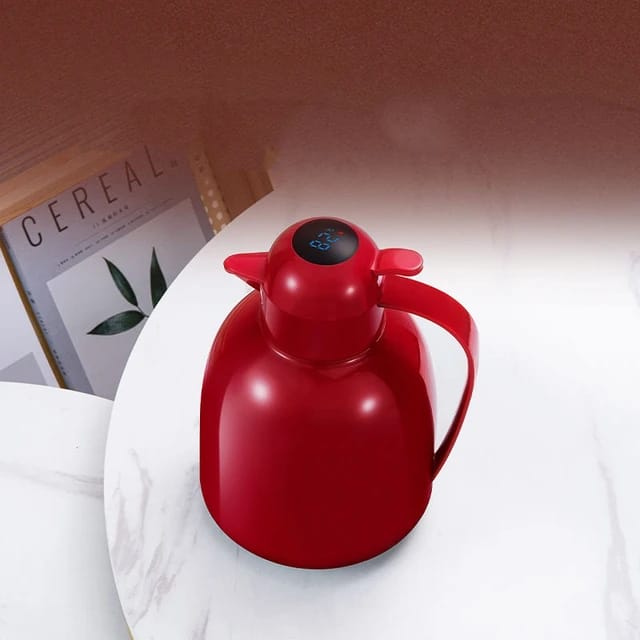 LED Temperature Display Vacuum Insulated Flask elegantly placed on the plate next to books