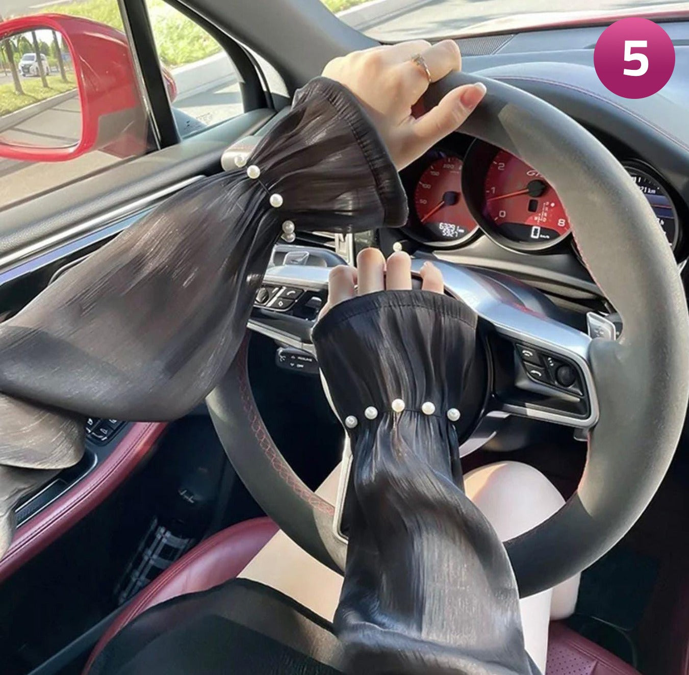 A Women is Wearing Women Summer Arm Sleeves While Driving.