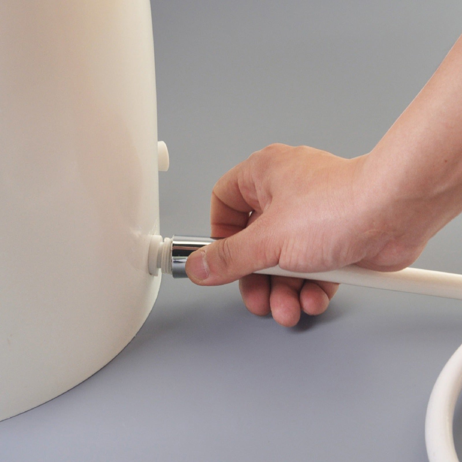 A Person is Installing Automatic Wudu Foot Washer Basin.