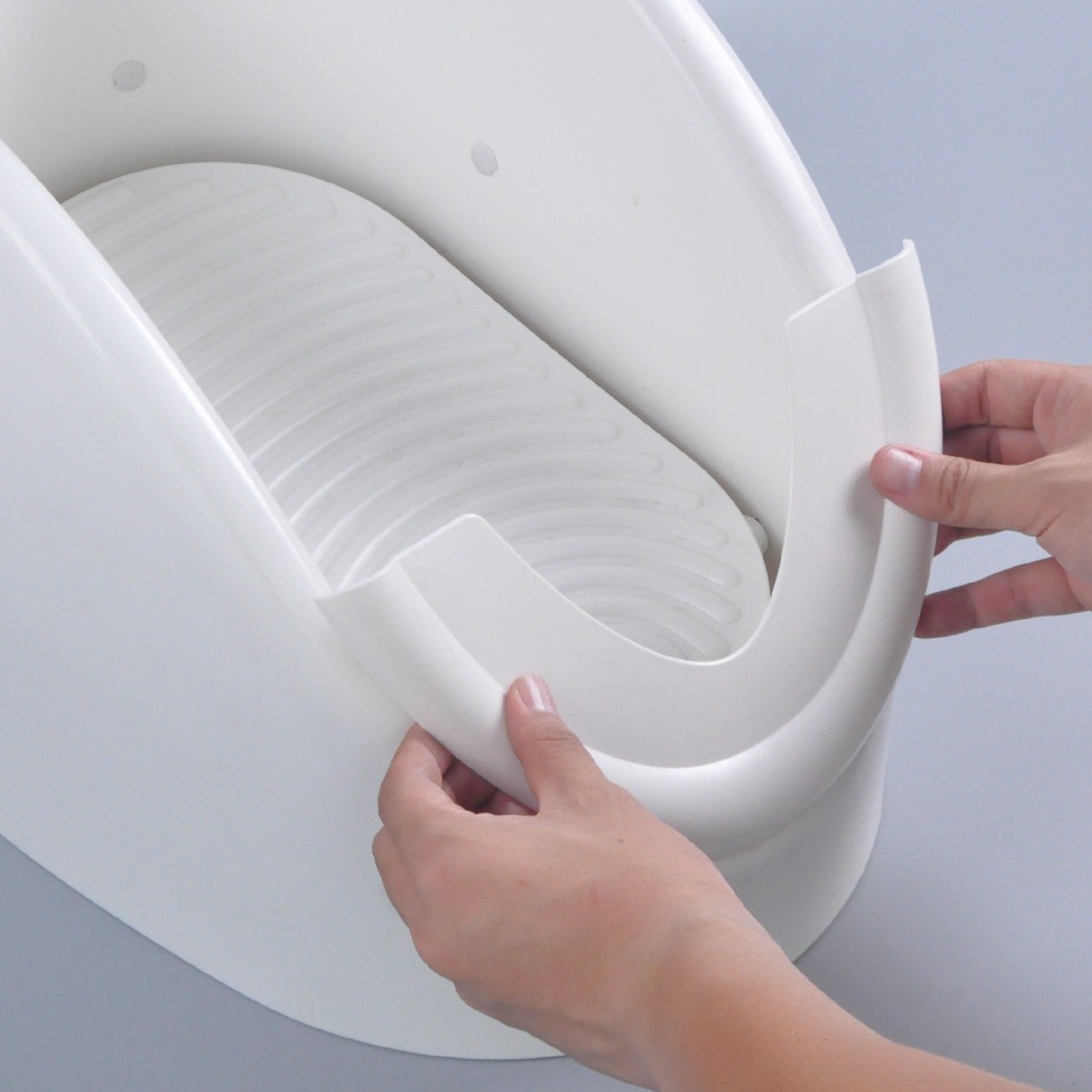 A Person is Fixing Automatic Wudu Foot Washer Basin.