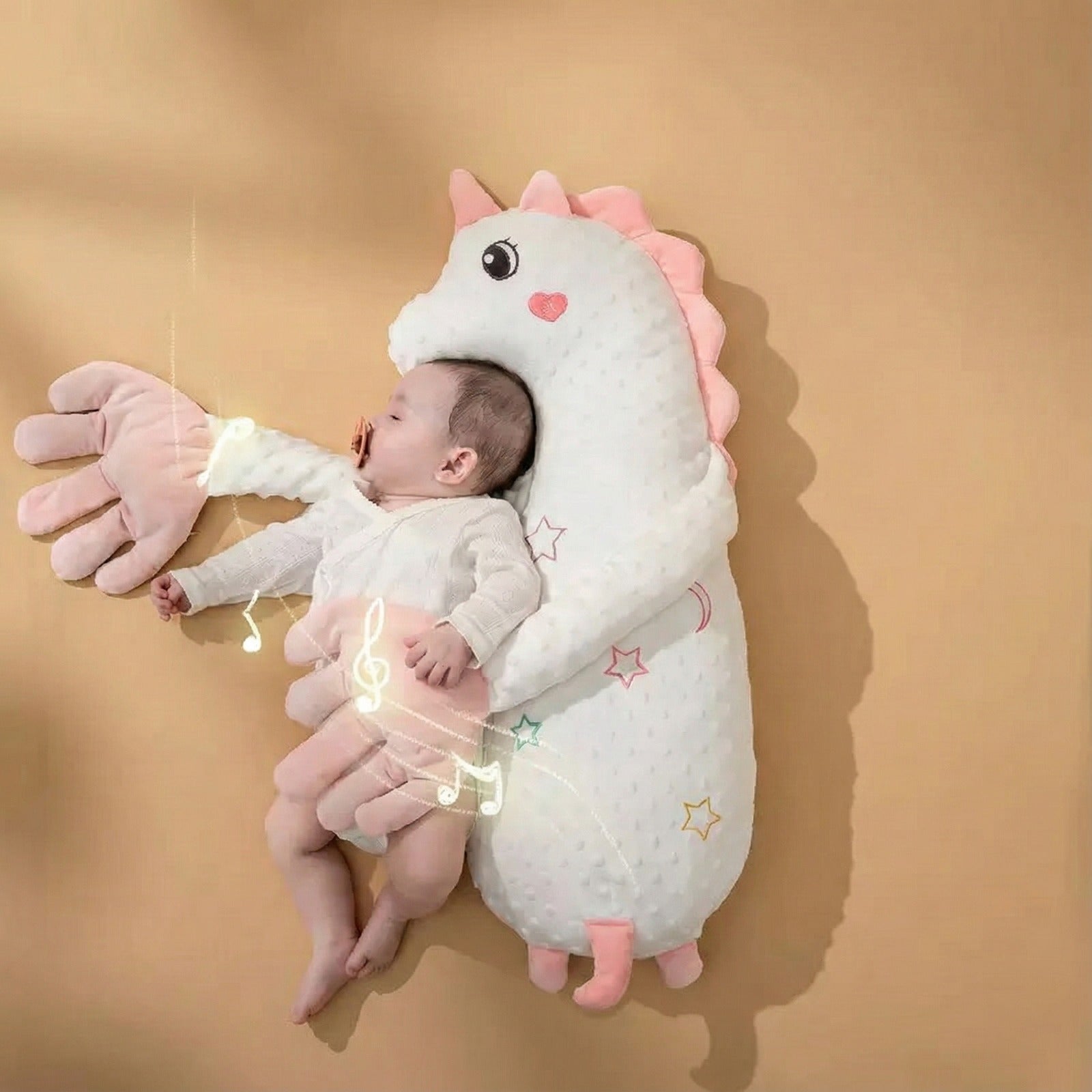 Baby sleeping comfortably in a Baby Patter cushion that cuddles and soothes with gentle arms.