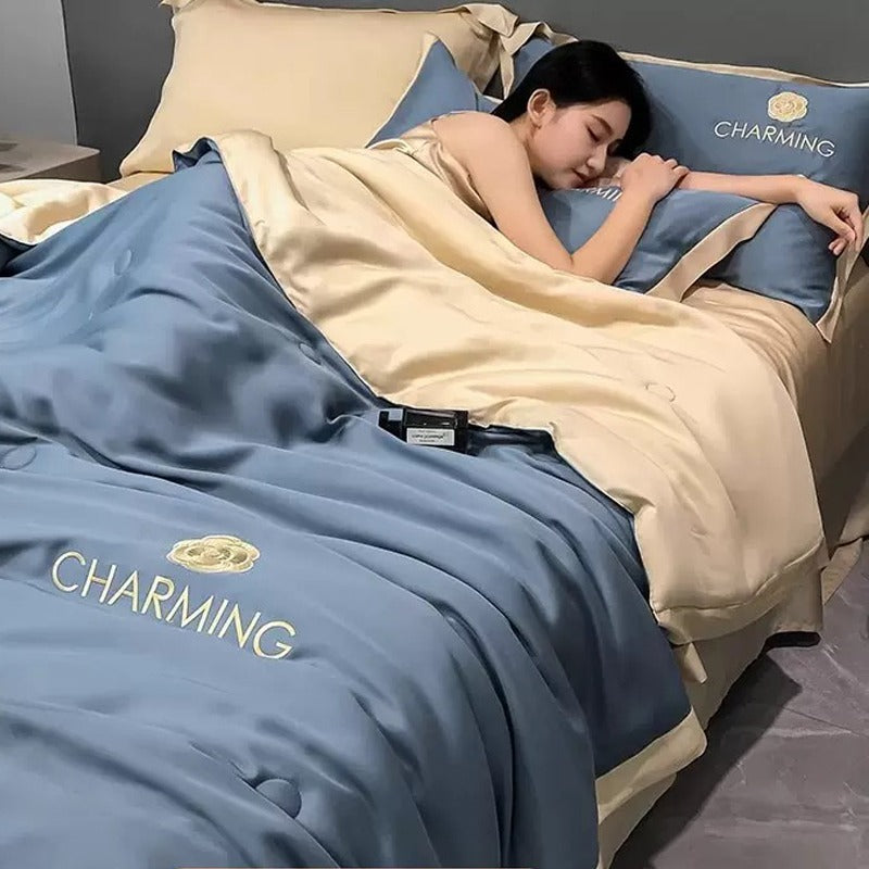 A Woman is Sleeping on Summer Quilted Cooling Comforter Bedding Set.