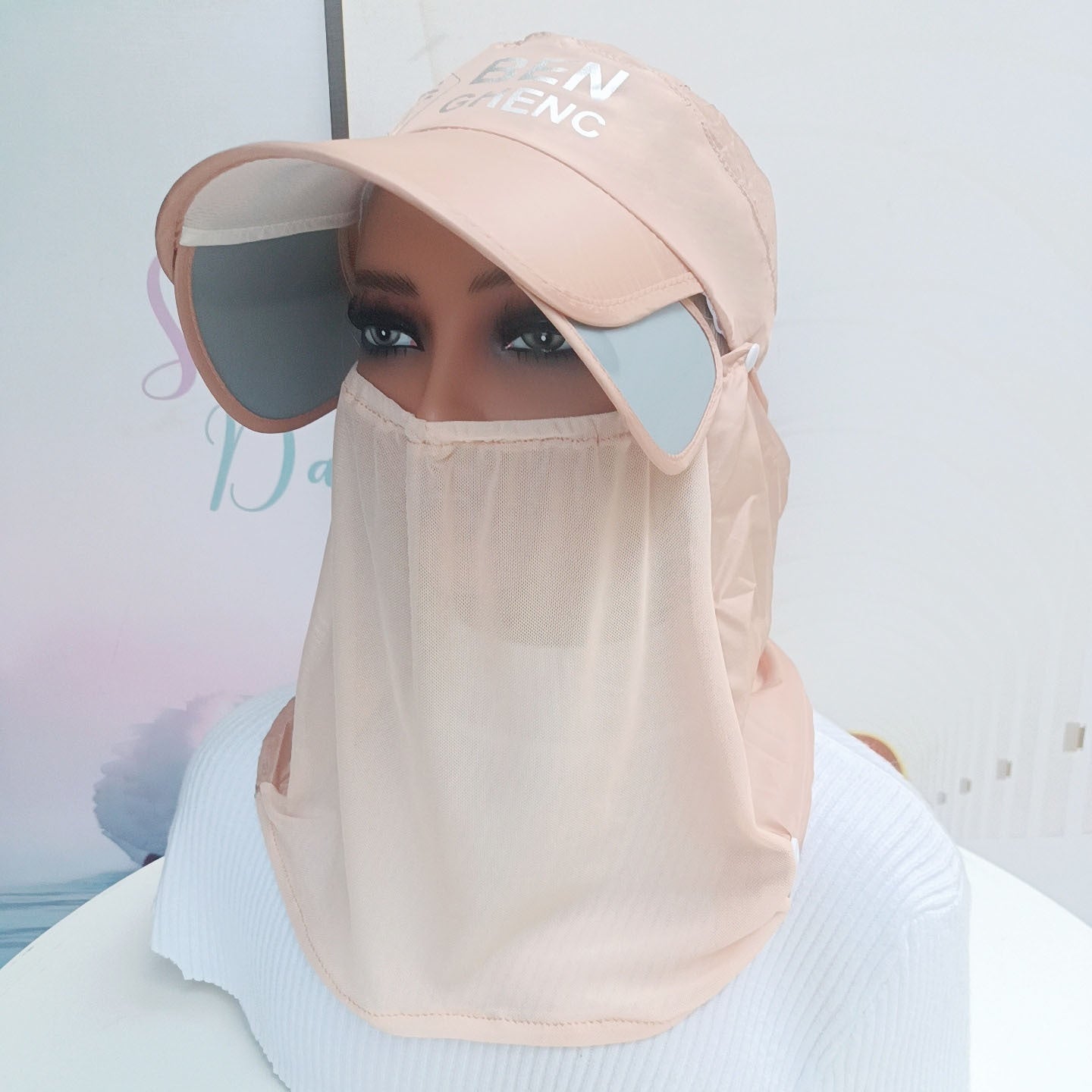 A Woman is Wearing Wide Brim Bucket Hat with Neck Cover.