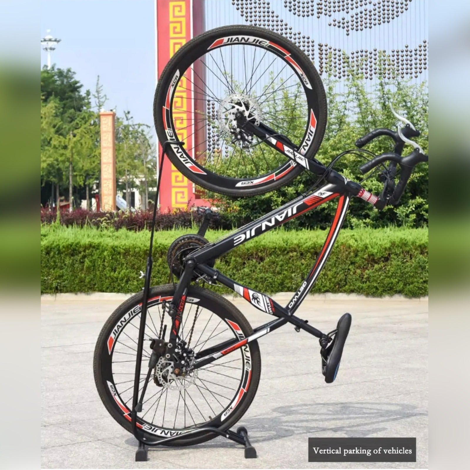 A Cycle Parked Vertically On Vertical Bike Stand.