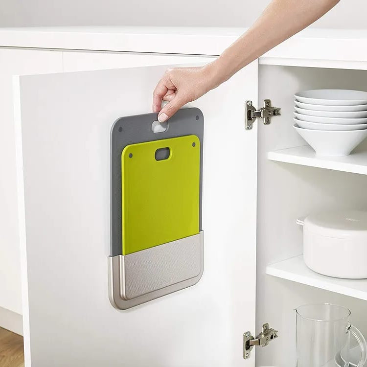 Someone is Taking Chopping Board from Case Of Chopping Board Set.