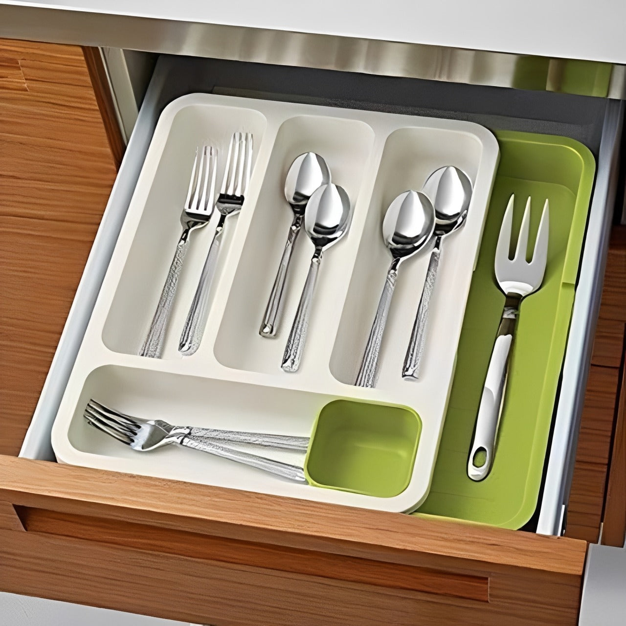 Kitchen Spoons and Cutleries are Kept at Expandable Cutlery Tray.