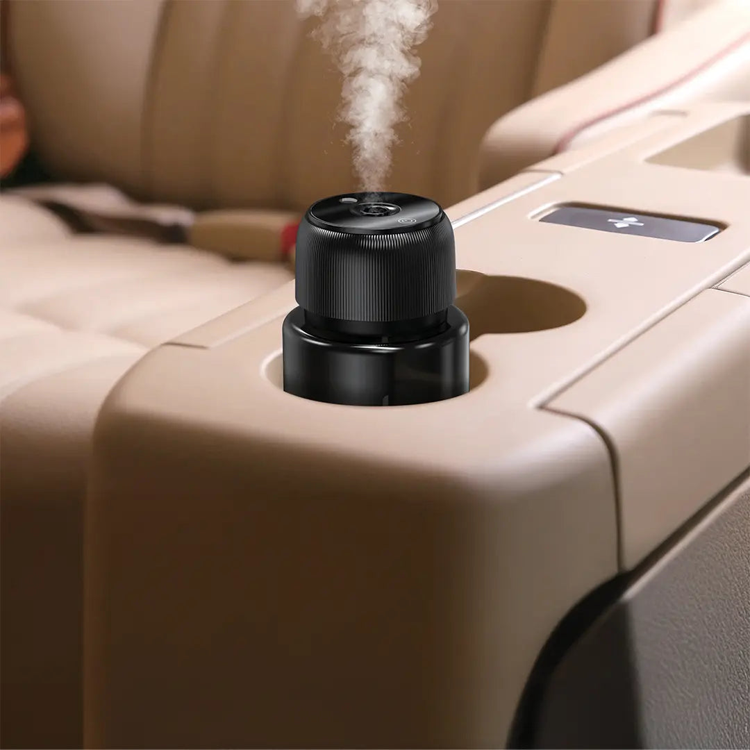 A Green Lion Fragrance Diffuser placed on a car dashboard, gently emitting visible steam