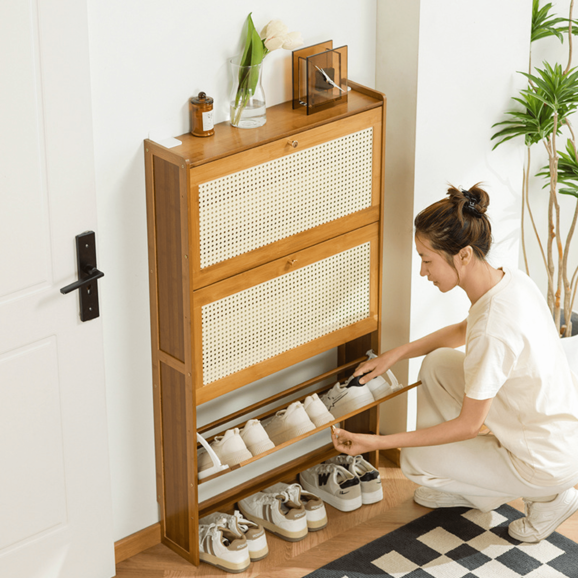 A Woman is Arranging Shoes In a Multi-Layer Wooden Flip Down Shoe Storage Organizer Rack.