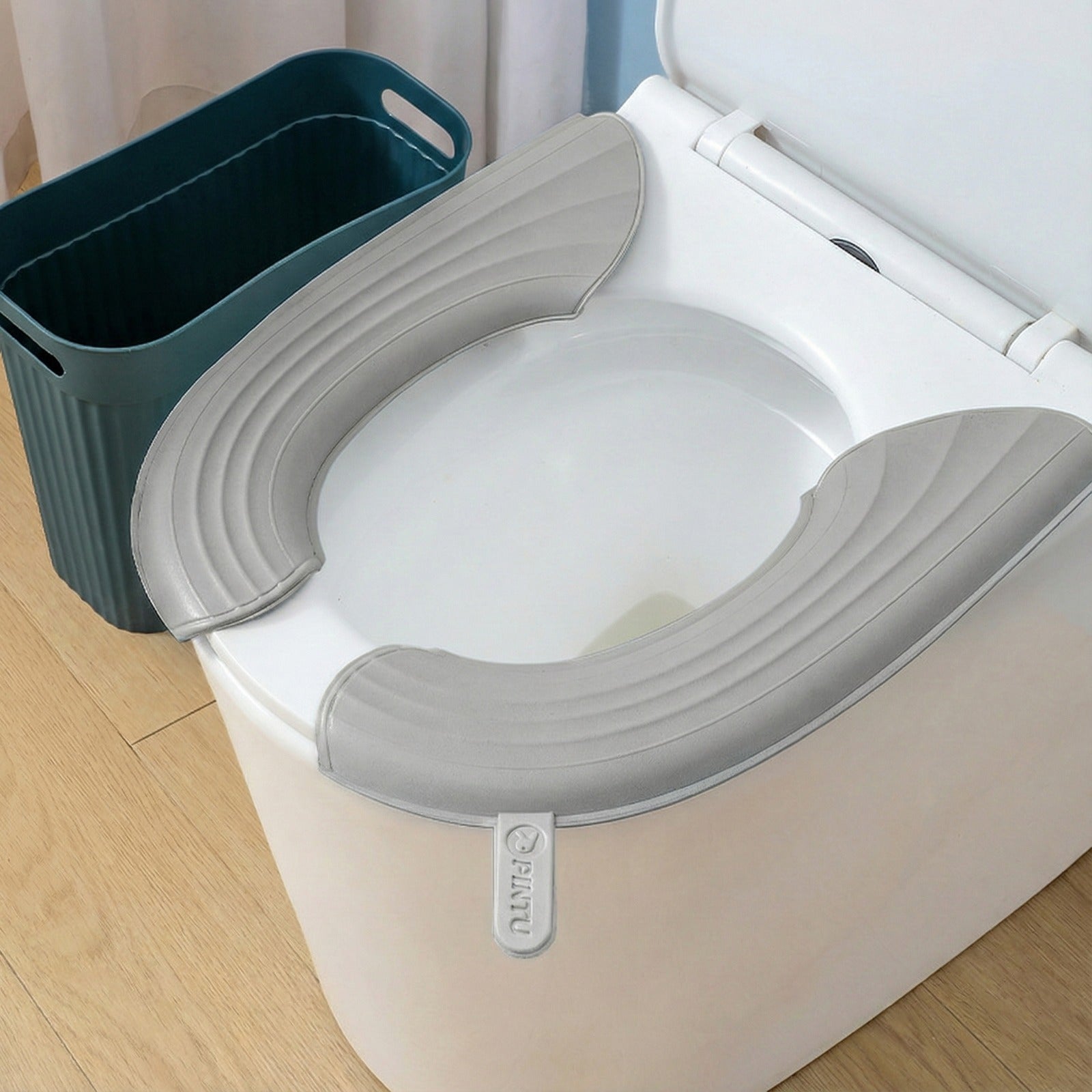 Soft waterproof Toilet Seat Cushion Cover, placed on a toilet seat for added comfort and hygiene.